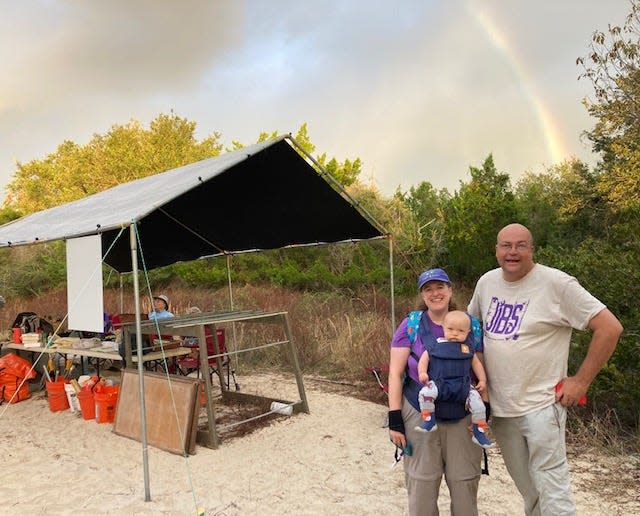 Heather, Leo and Evan Pitman stand beside Jekyll Island Banding Station after an early morning rain shower.