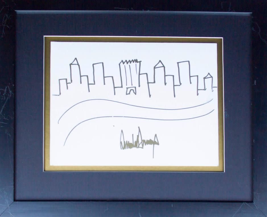 The painting is signed in gold by Trump. Photo: natedsanders.com