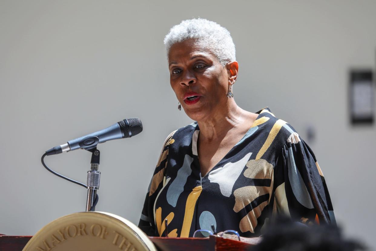 Rochelle Riley, director of the Detroit Arts, Culture & Entrepreneurship with the City of Detroit, announces Jessica Care Moore as Detroit's new poet laureate at Newlab in Detroit on Tuesday, April 30, 2024.