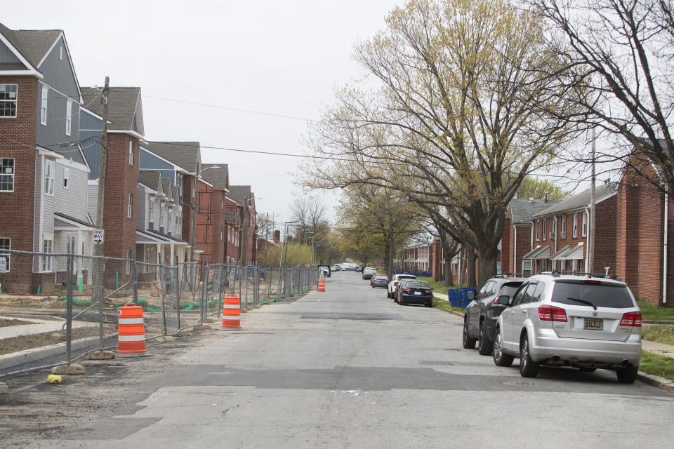 Boarded up homes sit within the older Wilmington Housing Authority homes across the street from the new affordable housing project as part of the Reach Riverside improvements to the neighborhood Monday, April 25, 2022. 