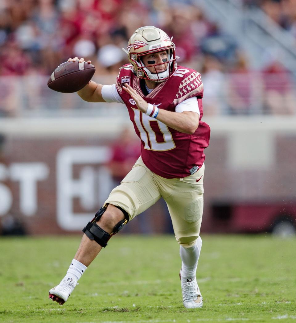 Florida State Seminoles quarterback McKenzie Milton (10)looks to pass. The Louisville Cardinals lead the Florida State Seminoles 31-13 at the half Saturday, Sept. 25, 2021.