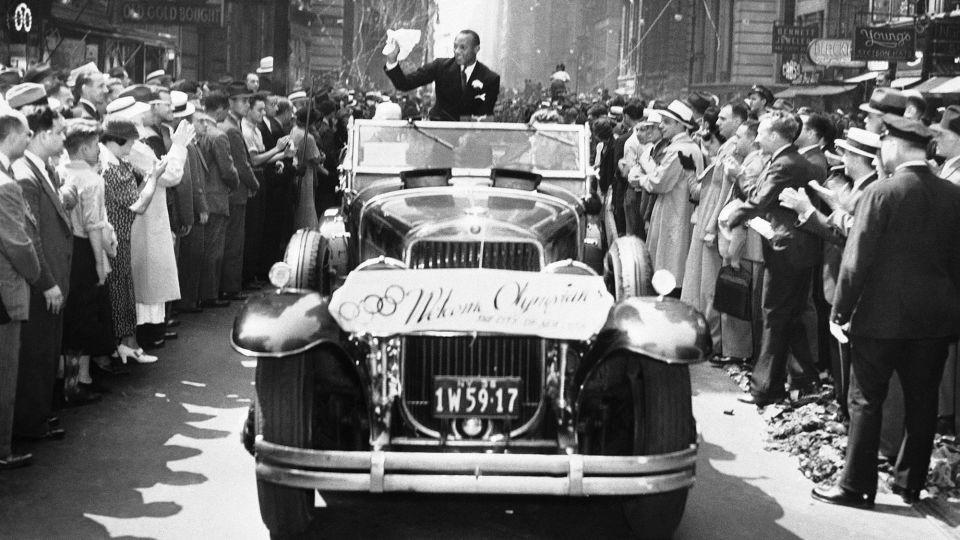 Owens received a rapturous welcome back to the US after the 1936 Olympic Games. - AP