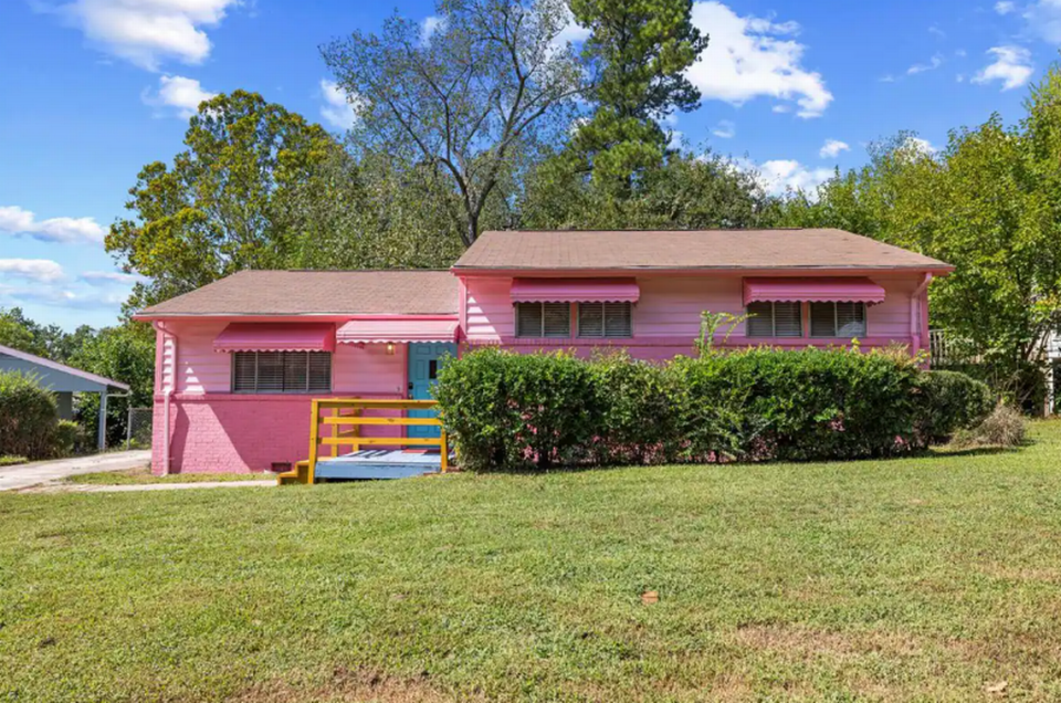 The Barbie Dream House Airbnb is decked out in the signature Barbie pink inside and outside of the home.