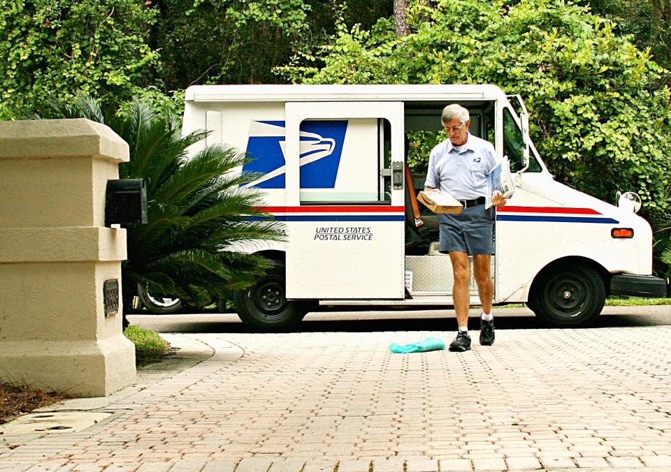 A mail carrier makes a delivery to a home on the Westside in 2007.
