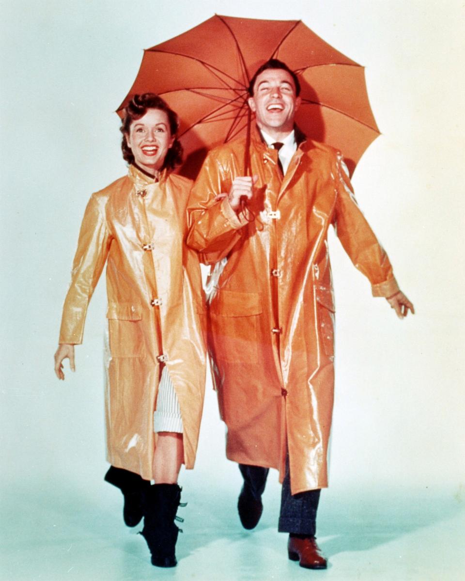 American dancer and actor Gene Kelly (1912 - 1996) as Don Lockwood and Debbie Reynolds as Kathy Seldon in 'Singin' in the Rain', directed by Stanley Donen and Kelly, 1952 (Photo by Silver Screen Collection/Hulton Archive/Getty Images)      