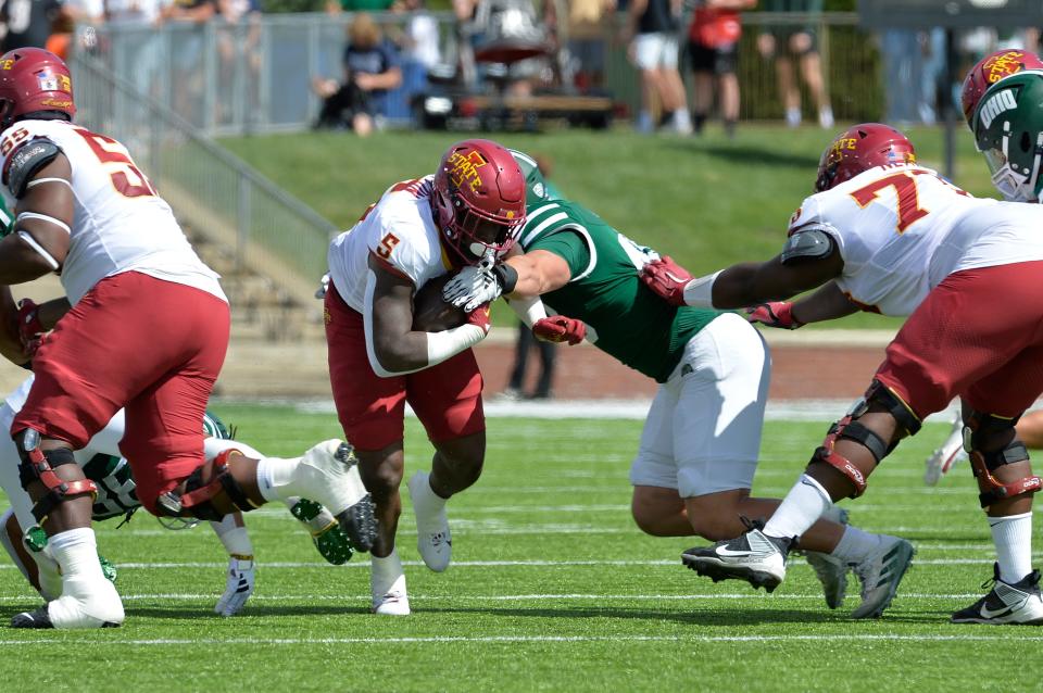 Iowa State Cyclones running back Cartevious Norton (5) runs the ball against Ohio Bobcats defensive tackle Tristan Cox (48) during the first quarter at Peden Stadium on September 16, 2023.