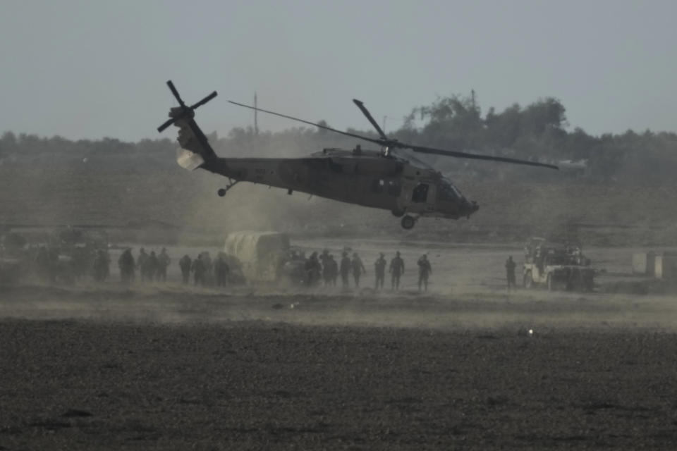 Israeli military helicopter lands near the Gaza Strip border on Saturday, Dec. 9, 2023. (AP Photo/Leo Correa)