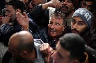 <p>A man gestures as he asks for a travel permit to cross into Egypt through the Rafah border crossing after it was opened by Egyptian authorities for humanitarian cases, in the southern Gaza Strip Feb. 8, 2018. (Photo: Ibraheem Abu Mustafa/Reuters) </p>