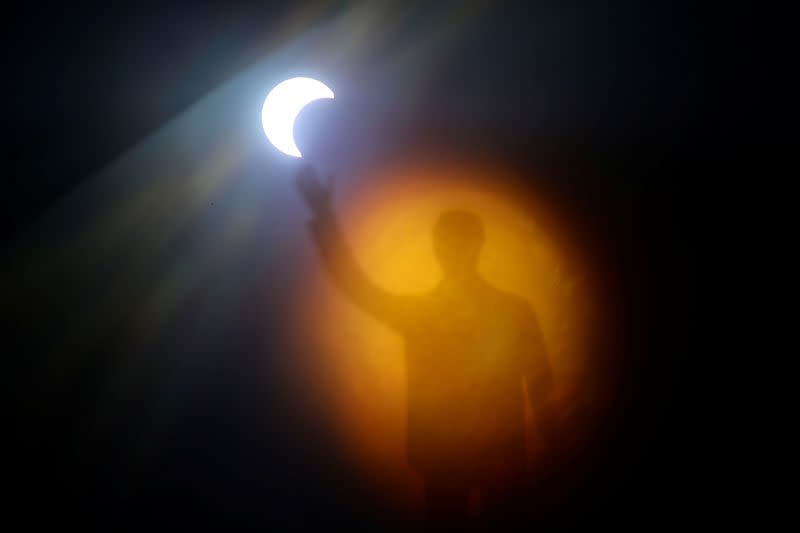 A solar eclipse is seen over Brasilia