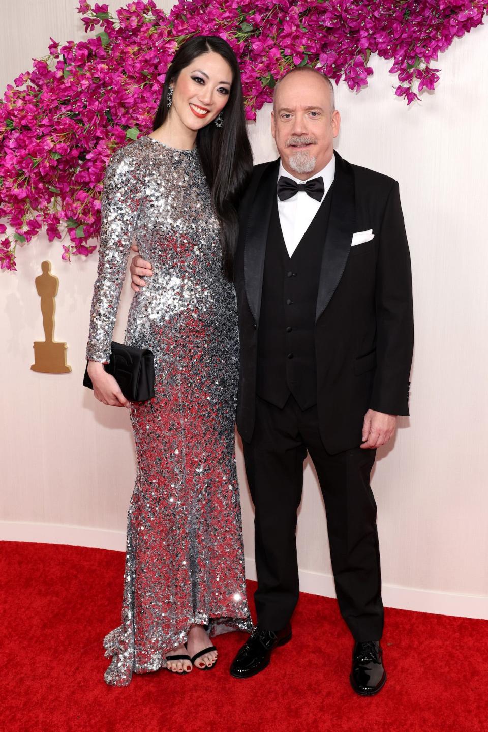 Clara Wong and Paul Giamatti attend the 96th Annual Academy Awards.