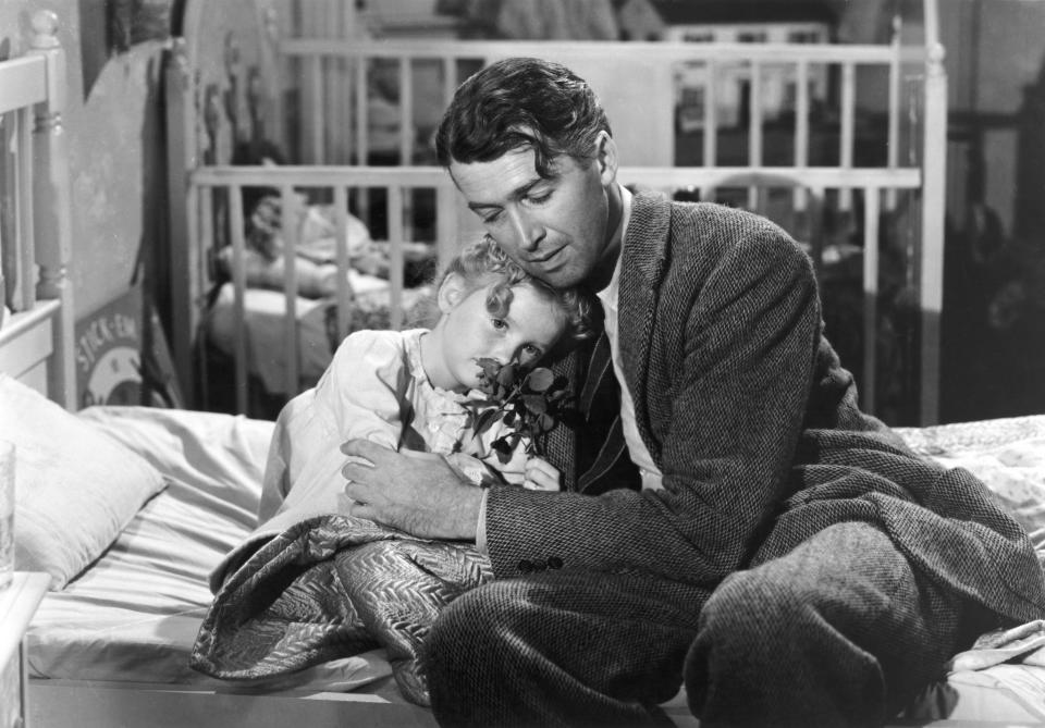 Karolyn Grimes, left, with her screen dad Jimmy Stewart in "It's a Wonderful Life."