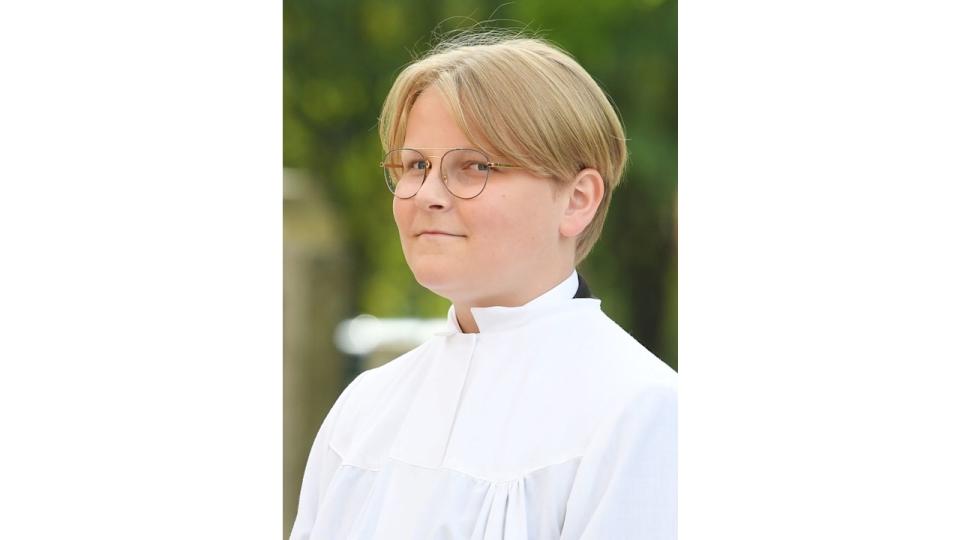 Prince Sverre in a white confirmation gown