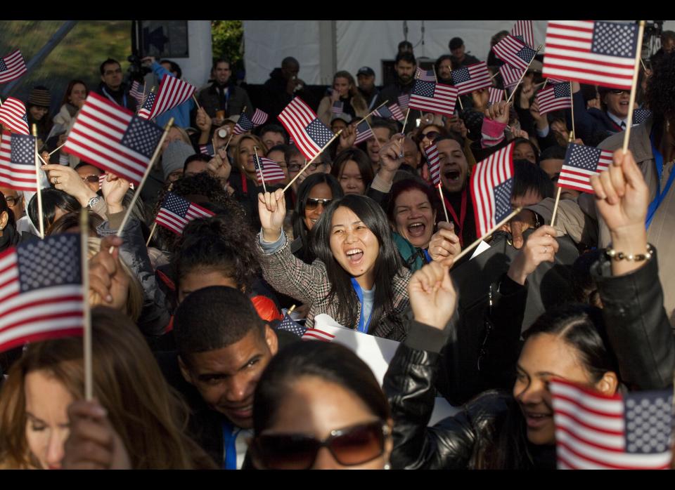 NEW YORK - OCTOBER 28:  New citizens cheer and wave at a naturalization ceremony at Liberty Island on October 28, 2011 in New York City.  125 citizens were naturalized in honor of the Statue of Liberty's 125th birthday.  (Photo by Michael Nagle/Getty Images)