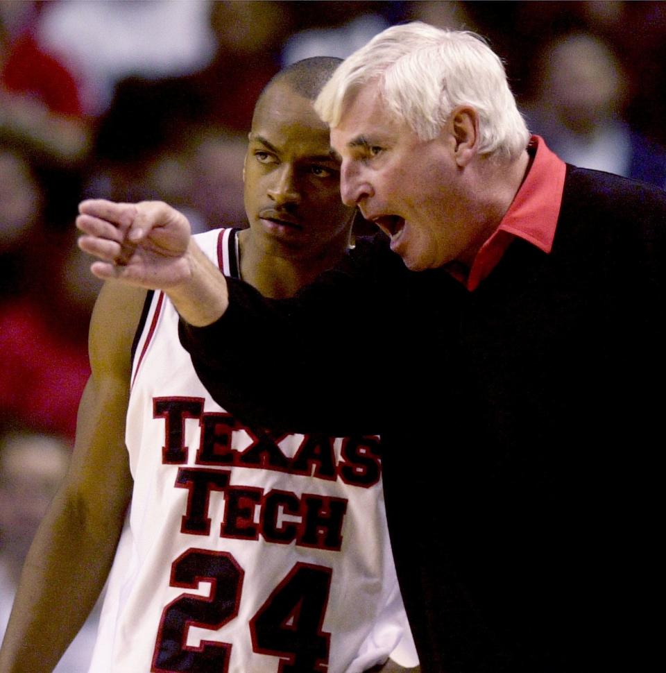 Texas Tech coach Bob Knight instructs Ronald Ross during a game against Oklahoma State in 2002, in Lubbock, Texas.