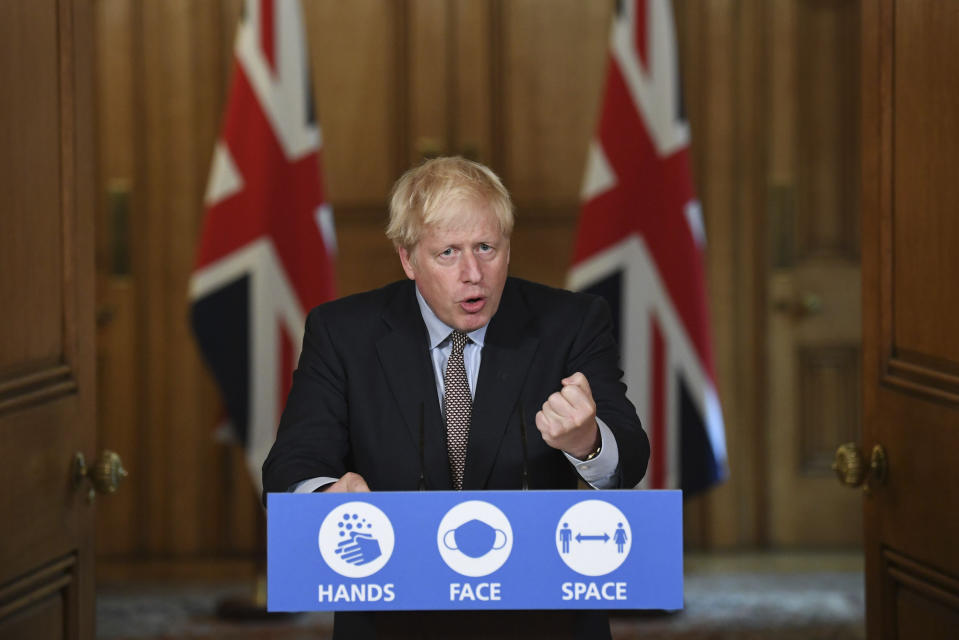 Britain's Prime Minister Boris Johnson speaks during a virtual press conference at Downing Street, London, Wednesday Sept. 9, 2020, following the announcement that the legal limit on social gatherings is set to be reduced from 30 people to six. The change in England will come into force on Monday as the Government seeks to curb the rise in coronavirus cases. (Stefan Rousseau/Pool via AP)