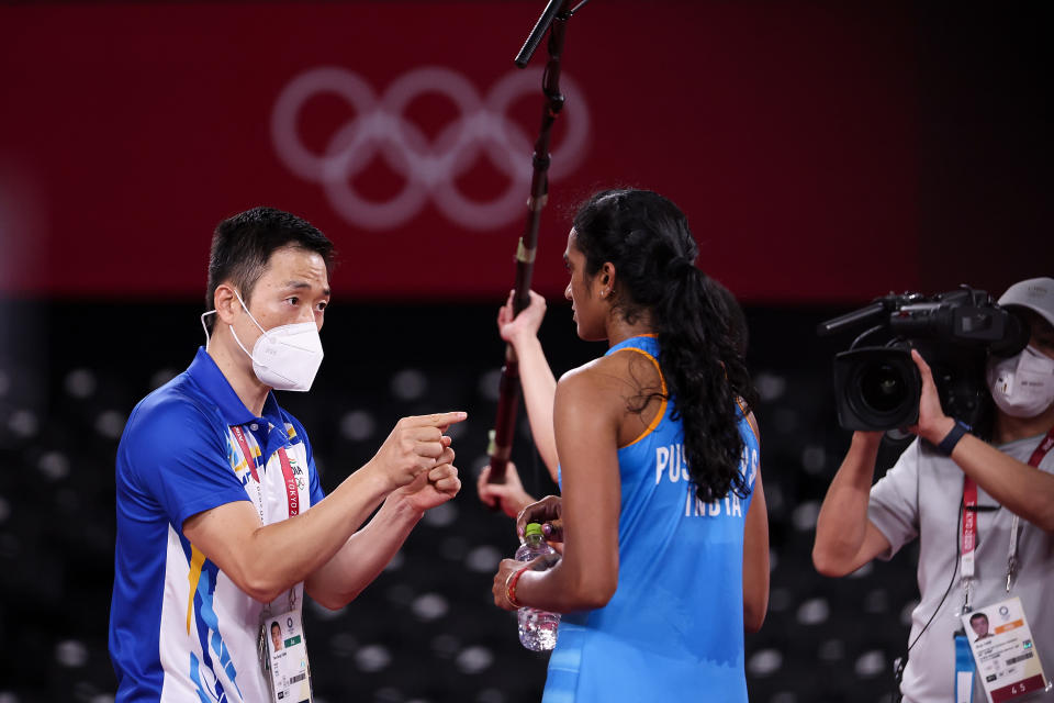 PV Sindhu of Team India talks to her coach Park Tae-Sang