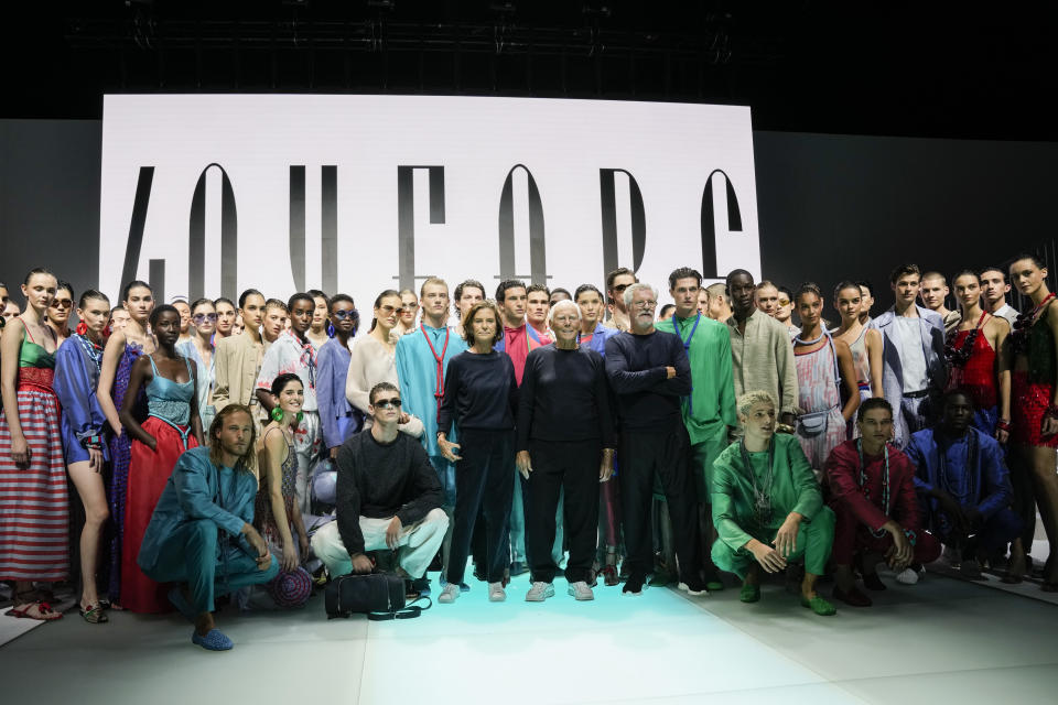 Silvana Armani from centre left, Giorgio Armani and Leo Dell'Orco stand with models after the Emporio Armani Spring Summer 2022 collection during Milan Fashion Week, in Milan, Italy, Thursday, Sept. 23, 2021. (AP Photo/Luca Bruno)