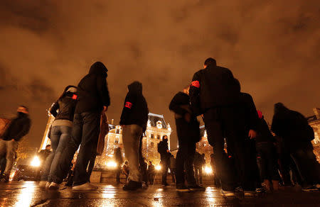 Police officers gather during an unauthorised protest against anti-police violence in front of the Police Prefecture in Paris, France, October 21, 2016. REUTERS/Jacky Naegelen