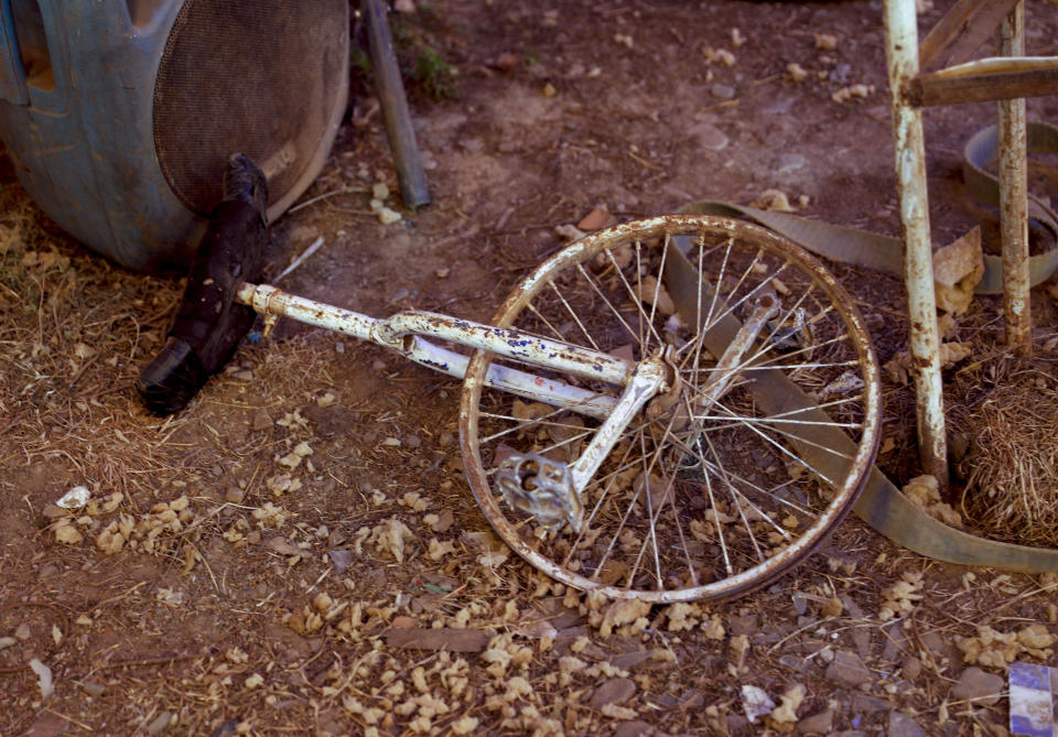 A discarded unicycle lays on the ground at the Jumbo Circus as it enters its fourth month closed due to the COVID-19 lockdown in El Alto, Bolivia, Monday, June 15, 2020. Before the lockdown, the circus held one daily performance on weekdays and twice a day on weekends. (AP Photo/Juan Karita)