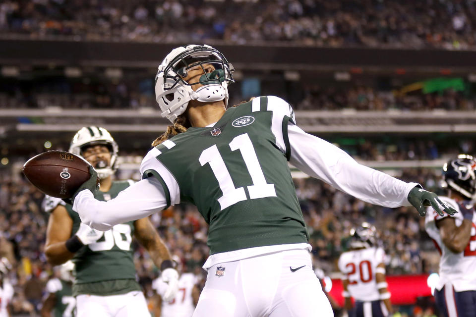 New York Jets wide receiver Robby Anderson (11) launches the football into the stands after catching a touchdown pass from quarterback Sam Darnold (not shown) during the first half of an NFL football game against the Houston Texans, Saturday, Dec. 15, 2018, in East Rutherford, N.J. (AP Photo/Adam Hunger)