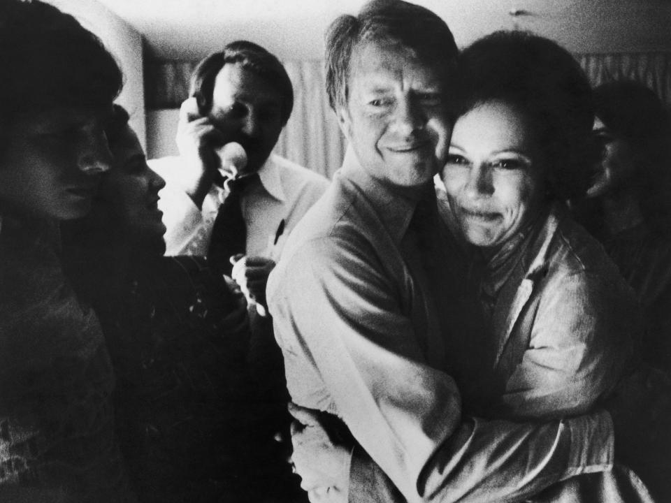 Jimmy Carter embraces his wife Rosalynn after receiving the final news of his victory in the national general election, November 2, 1976