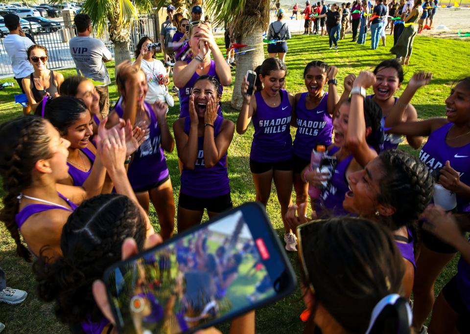 Shadow Hills runners celebrate after their race at the first DEL cross country meet of the year at Xavier College Preparatory High School in Palm Desert, Calif., Wednesday, Sept. 20, 2023.
