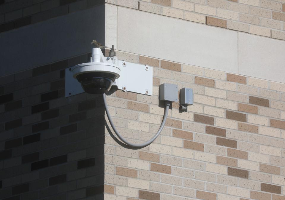St. John Fisher University went into a brief lockdown June 18th after AI software in the school’s surveillance system mistook prop guns being used in a theater rehearsal as real guns. A security camera sits above the corner of a residence hall.