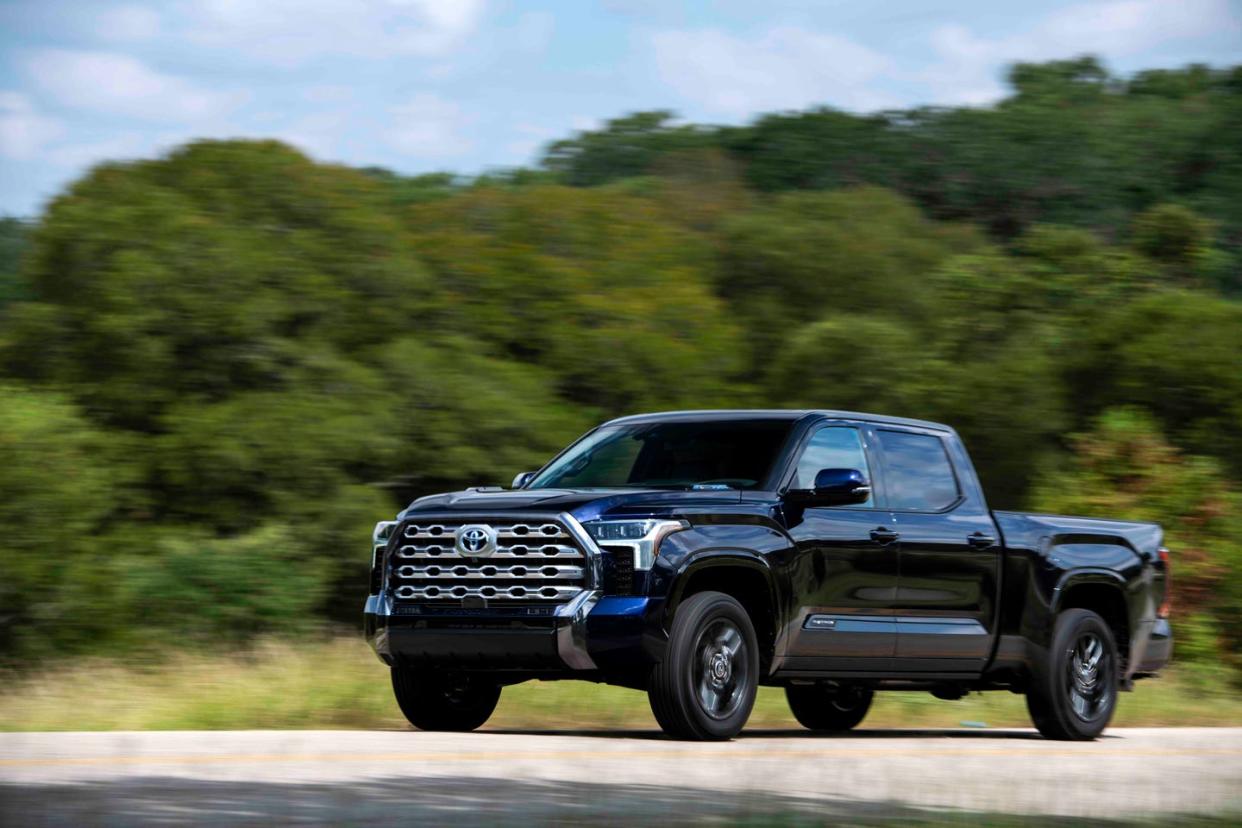 a black truck on a road