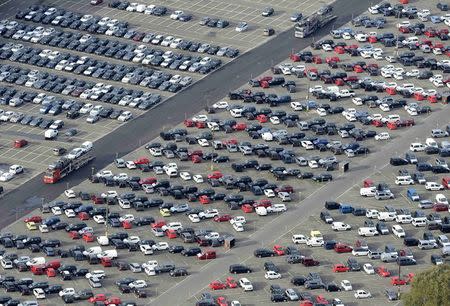 Cars stand in a parking area at a shipping terminal in the harbour of the German northern town of Bremerhaven, in this October 8, 2012 file picture. In recent weeks, the economy that proud German politicians have taken to describing as a "growth locomotive" and "stability anchor" for Europe, has been hit by a barrage of bad news that has surprised even the most ardent Germany sceptics. The big shocker came on August 14, 2014, when the Federal Statistics Office revealed that gross domestic product (GDP) had contracted by 0.2 percent in the second quarter. Picture taken October 8, 2012. TO MATCH STORY GERMANY-ECONOMY/ REUTERS/Fabian Bimmer/Files (GERMANY - Tags: TRANSPORT BUSINESS)