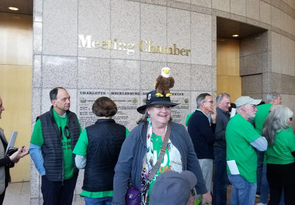 Robin Berkman wears a hat with a bald eagle to bring attention to a developer wanting to build hundreds of homes near a nesting area in south Charlotte.