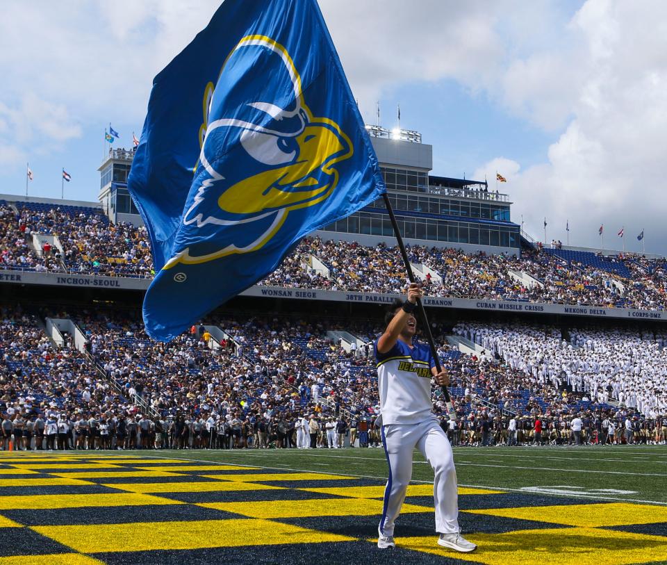 YouDee looks out over the field from a flag after the Hens took a quick 7-0 lead in the first quarter of the Blue Hens' 14-7 win at Navy-Marine Corps Memorial Stadium in Annapolis, Md., Saturday, Sept. 3, 2022.