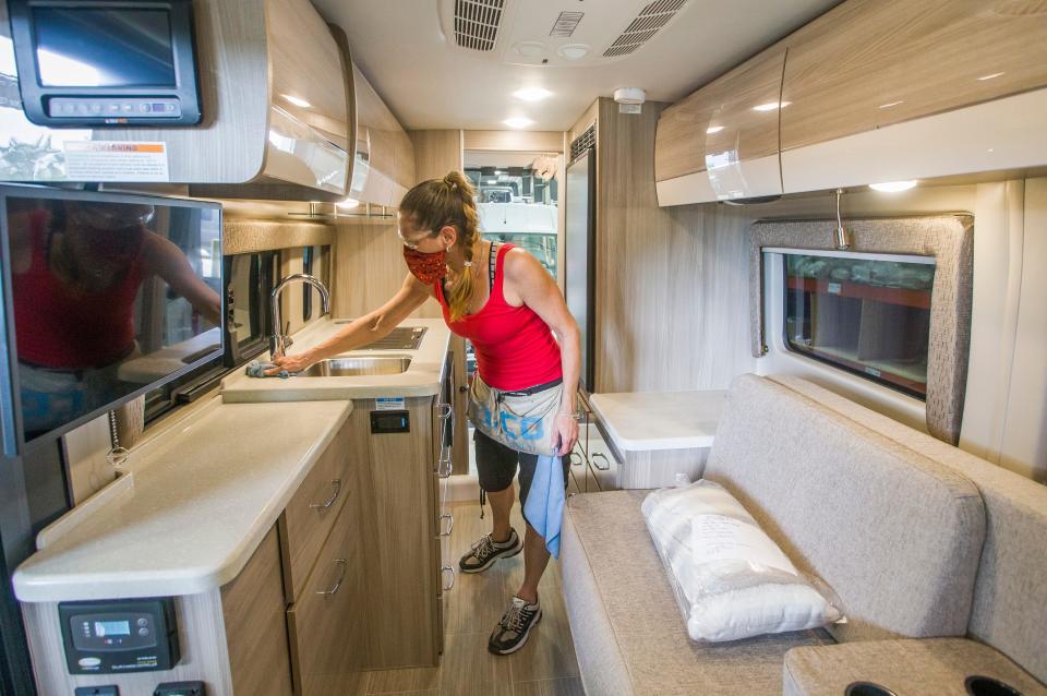 Thor employee Vicki Bentley cleans a completed RV inside Thor Motor Coach's Elkhart West assembly plant on Friday, June 5, 2020, in Elkhart. 
