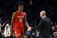 Maryland forward Julian Reese (10) shakes hands with coach Kevin Willard after fouling out during the second half of the team's second-round college basketball game against Alabama in the men's NCAA Tournament in Birmingham, Ala., Saturday, March 18, 2023. (AP Photo/Butch Dill)