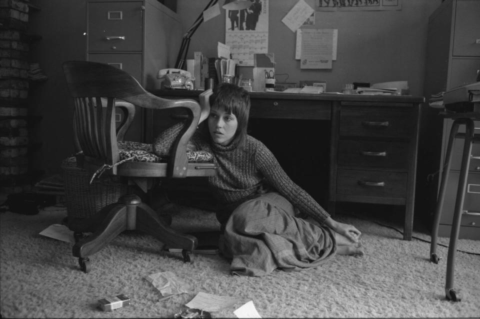 <p>Jane Fonda sits on the floor beside her desk in Hollywood in 1971.</p>