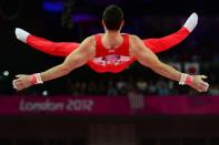 Great Britain's gymnast Kristian Thomas competes at the horizontal bar during the men's team final of the artistic gymnastics event of the London Olympic Games at the 02 North Greenwich Arena in London. Britain won bronze