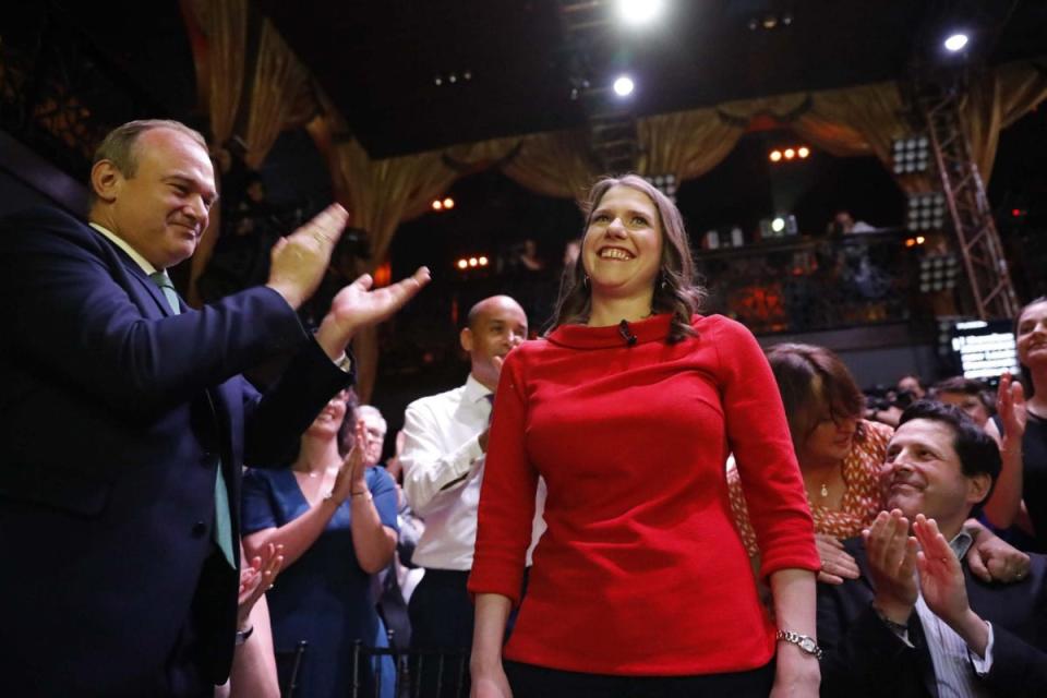 New Liberal Democrat leader Jo Swinson after her victory in the leadership contest, as Ed Davey and her husband, Duncan Hames, applaud (Tolga Akmen / AFP / Getty Images)