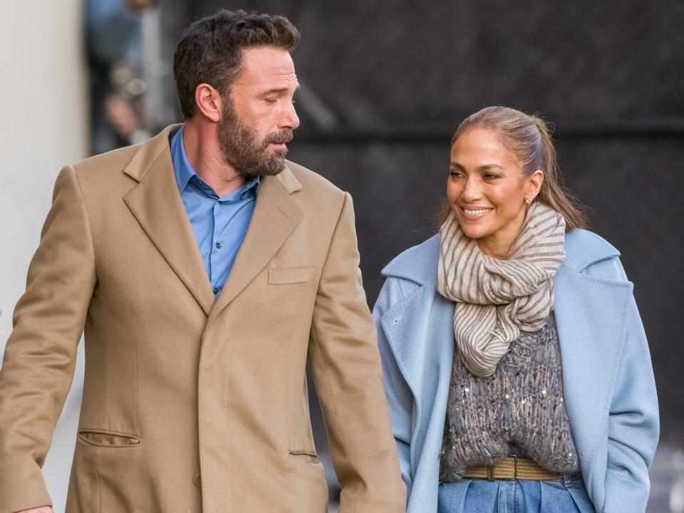 Ben Affleck and Jennifer Lopez holding hands while walking in LA in December 2021.