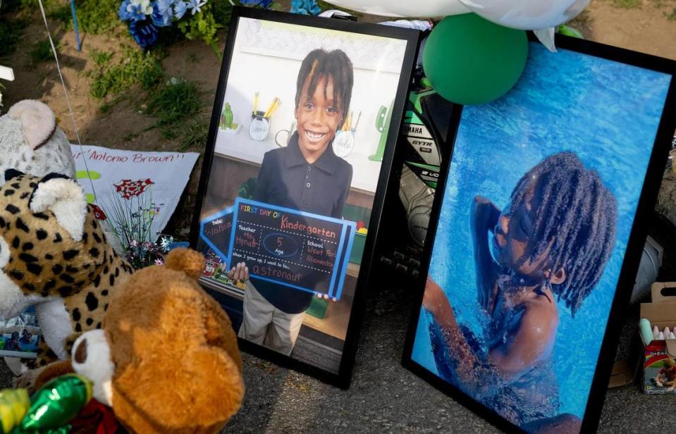 Photos of 6-year-old Sir’Antonio Brown help form a memorial on Wednesday, May 10, 2023, in Kansas City, Kan. Brown was killed May 3 while playing outside his home.