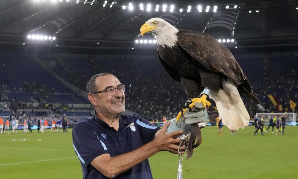 Maurizio Sarri, smiling through the pain as he tries to hold aloft Olimpia.