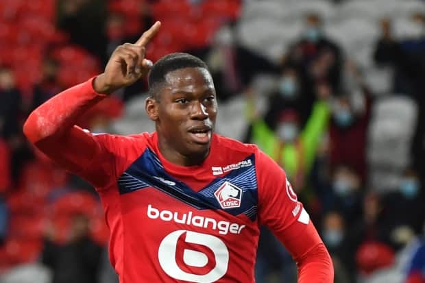 Rising Canadian soccer star Jonathan David scored one goal and helped set up the other Sunday as Lille sealed the French Ligue 1 title with a 2-1 victory over Angers. (AFP via Getty Images - image credit)