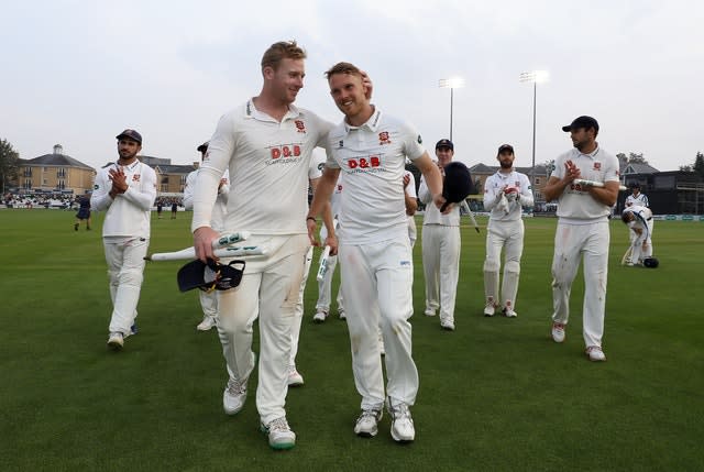 Jamie Porter (right) celebrates Essex's 2019 County Championship win.