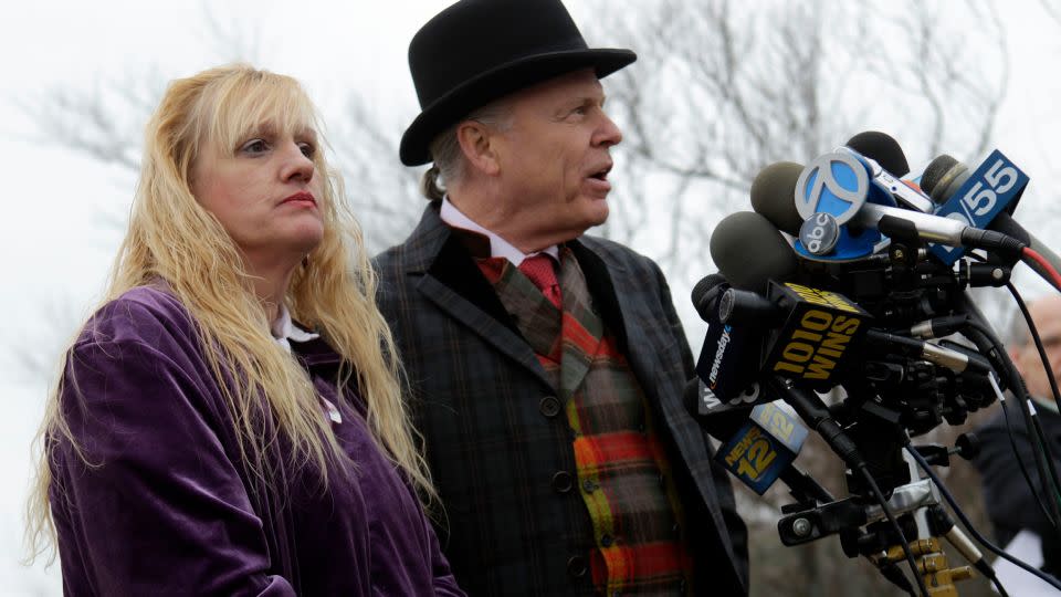 Mari Gilbert, left, with her lawyer John Ray at a news conference in 2011.   - Seth Wenig/AP