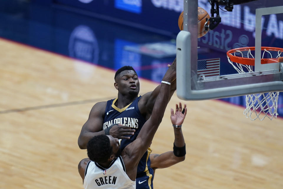 New Orleans Pelicans forward Zion Williamson shoots over Brooklyn Nets forward Jeff Green in the second half of an NBA basketball game in New Orleans, Tuesday, April 20, 2021. (AP Photo/Gerald Herbert)