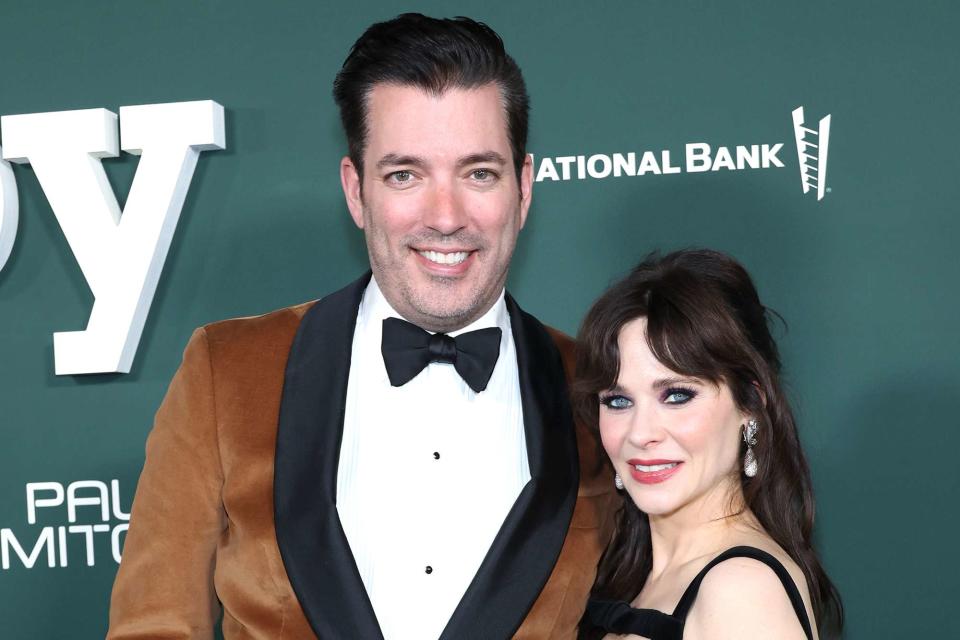 <p>Monica Schipper/Getty </p> Jonathan Scott and Zooey Deschanel