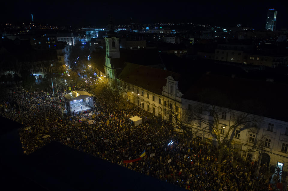 People take part in a protest against scrapping the Special Prosecutor's Office in Bratislava, Thursday, Feb. 1, 2024. Mass street protests intensified on Thursday across Slovakia against a plan by populist Prime Minister Robert Fico to amend the penal code and eliminate a national prosecutors’ office. (Jakub Kotian/TASR via AP)