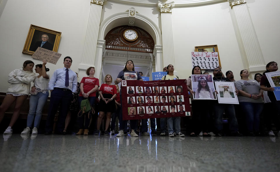 Veronica Mata, center, and other family members of the victims of the Uvalde shooting protest for the Texas legislature to take up a bill to limit the age for purchasing AR-15 style weapons in Austin, Texas, Monday, May 8, 2023. For Mata, teaching kindergarten in Uvalde after her daughter was among the 19 students who were fatally shot at Robb Elementary School became a year of grieving for her own child while trying to keep 20 others safe. (AP Photo/Eric Gay)