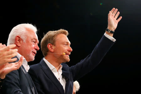 Free Democratic Party (FDP) leader Wolfgang Kubicki (L) and the leader of Germany's Free Democrats (FDP) Christian Lindner react at the FDP party convention in Berlin, Germany, September 17, 2017. REUTERS/Axel Schmidt