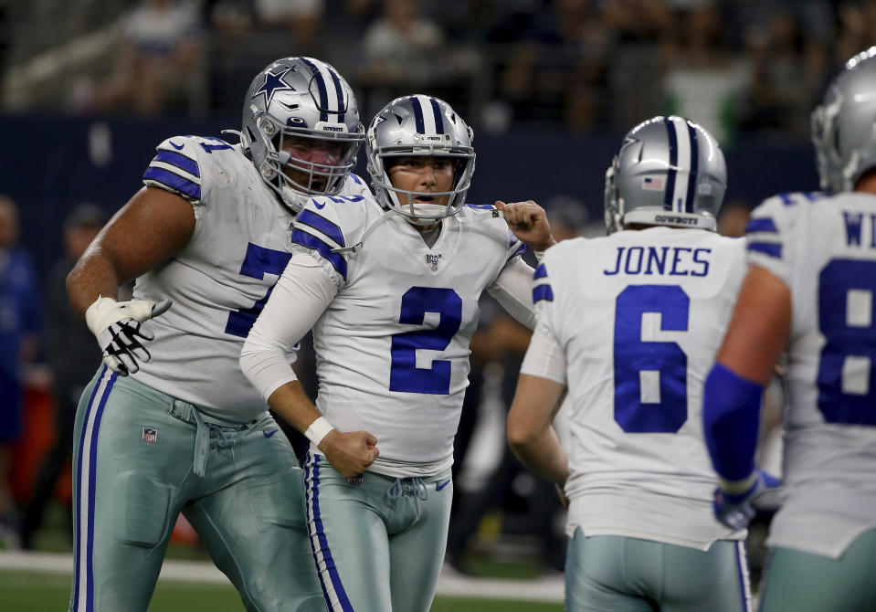 Dallas Cowboys' La'el Collins (71), from left, Brett Maher (2) and Chris Jones (6) celebrate a 63-yard field goal kicked by Maher in the first half of an NFL football game against the Philadelphia Eagles in Arlington, Texas, Sunday, Oct. 20, 2019. (AP Photo/Ron Jenkins)