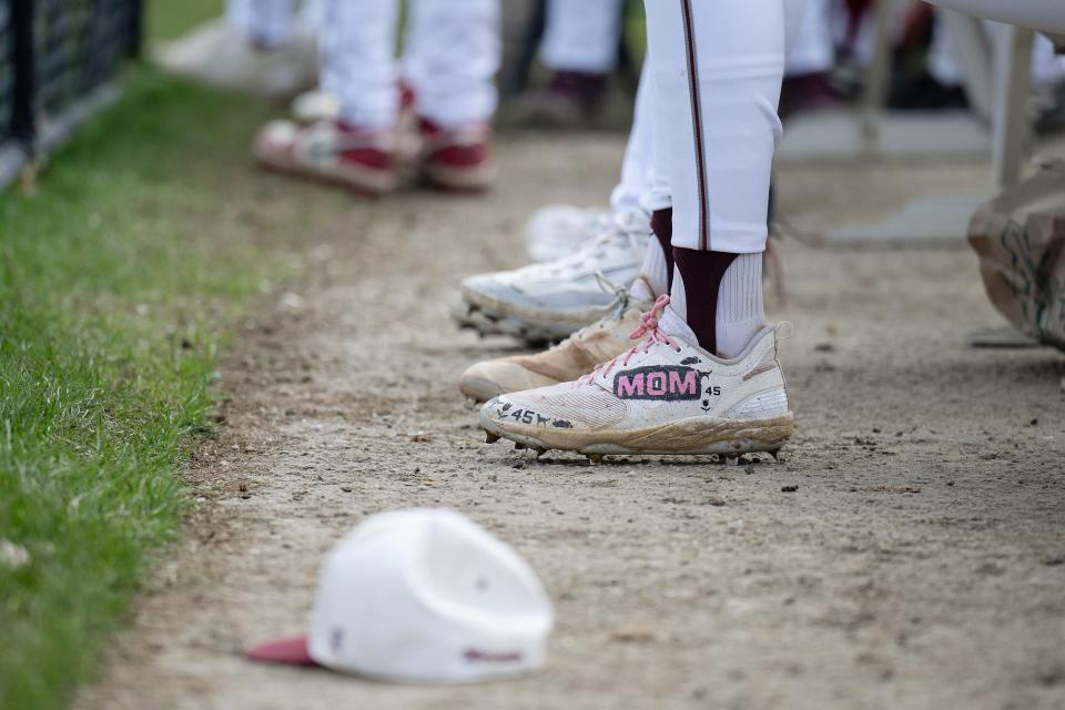 Worcester Academy's Mavrick Rizy has mom painted on his left cleat.