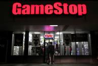 FILE PHOTO: People enter a GameStop store during "Black Friday" sales in Carle Place, New York